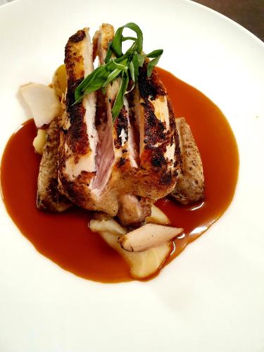 a plate of food with a piece of meat with sauce at De Buren in Vleuten