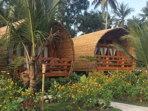 Сад в Lagoona Beach Bungalows - Eco Stay