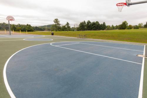 a basketball court with a basketball hoop at Rough River Dam State Resort Park in Fentress McMahan