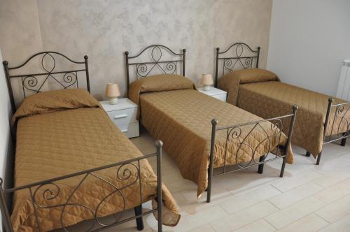 Tempat tidur dalam kamar di Villa Rahal
