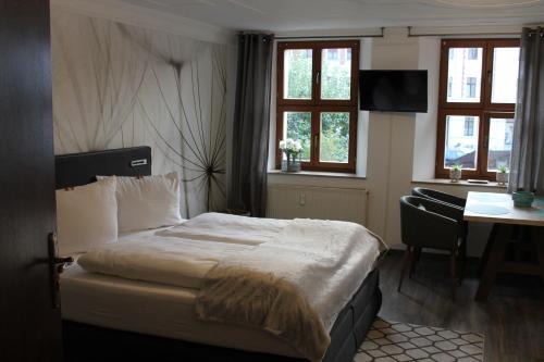 Кровать или кровати в номере Pension Wielsch