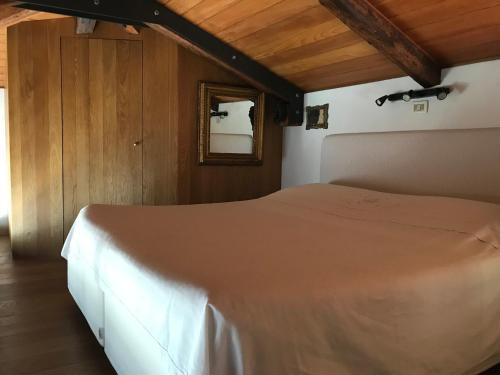 Кровать или кровати в номере Maison Claudià al Lido di Venezia