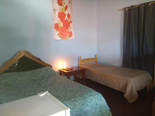 Ένα ή περισσότερα κρεβάτια σε δωμάτιο στο Hummingbird Hostel