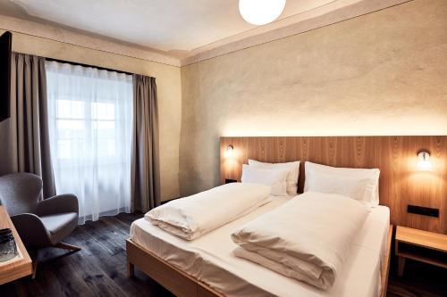 Un ou plusieurs lits dans un hébergement de l'établissement Hotel Walther v.d. Vogelweide Superior