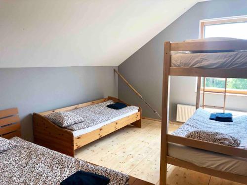 Katil atau katil-katil dalam bilik di Guesthouse Sidrabozoli