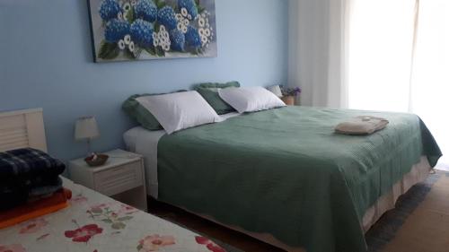Cama ou camas em um quarto em Residência Familiar