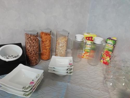a table with containers of food and other food items at Gästehaus - Café Frank in Antweiler
