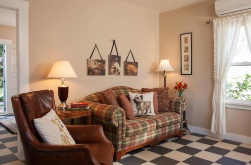 a living room with a couch and a chair at The Inn at Abeja in Walla Walla