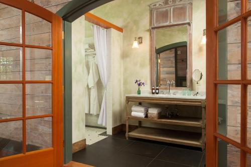a bathroom with a sink and a mirror at The Inn at Abeja in Walla Walla
