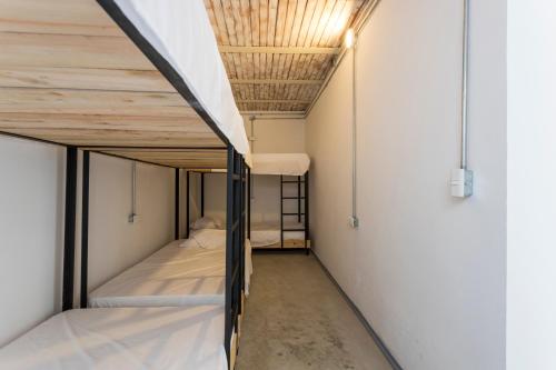 Una cama o camas en una habitación de Gastón Coliving