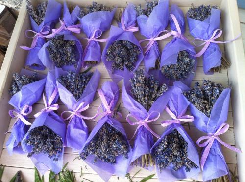 a box of purple flowers on a table at Lavender Village in Kiemeliai