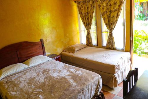 Postel nebo postele na pokoji v ubytování Posada Gema de Copan