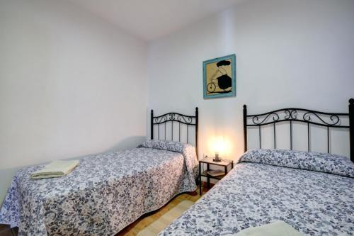A bed or beds in a room at Apartamento San Antonio