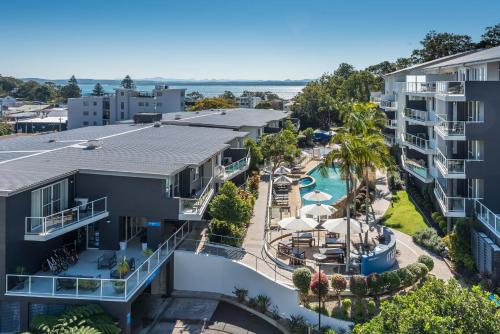 an aerial view of a resort with a swimming pool at Mantra Nelson Bay in Nelson Bay