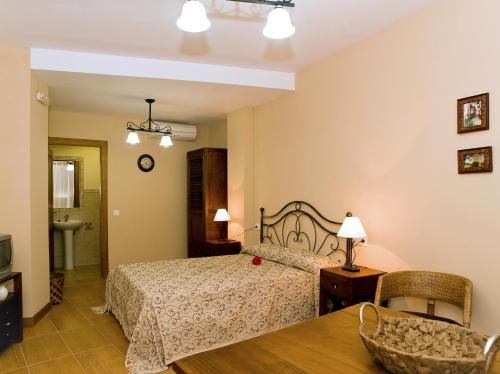 Ένα ή περισσότερα κρεβάτια σε δωμάτιο στο Apartamentos Rurales La Vera