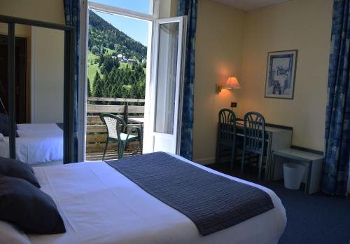 Postel nebo postele na pokoji v ubytování Hotel Le Beau Site
