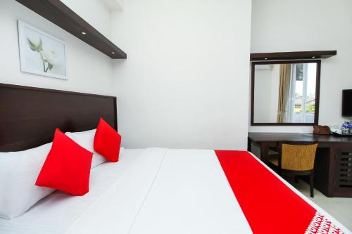 Ένα ή περισσότερα κρεβάτια σε δωμάτιο στο Hotel Nelly Marine