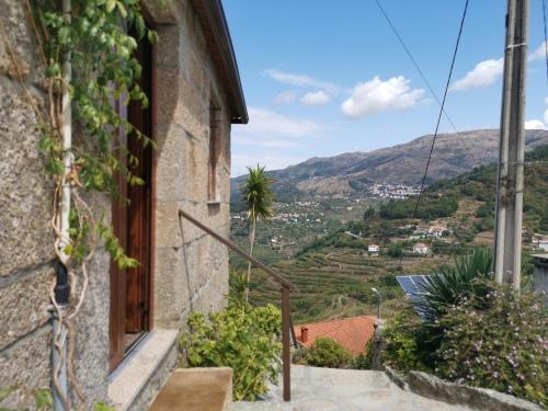 a window of a house with a view of a mountain at Casa da Eira - Castanheiras in Resende