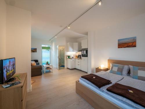 Llit o llits en una habitació de Holledau-Apartments Familie Gmeineder