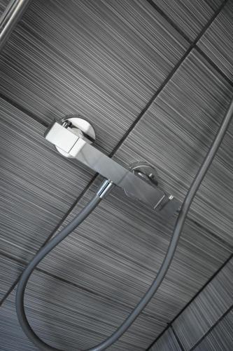 a light hanging from a ceiling with a wire at Apex Living NE - Beachville House 4 Beds FREE PARKING in Sunderland