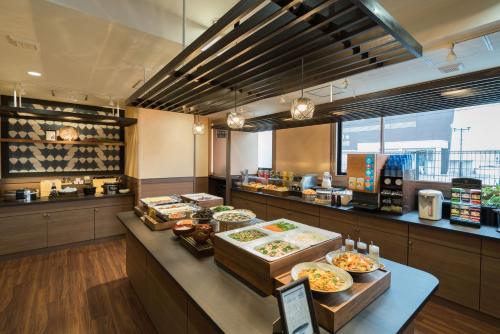 a buffet line with many different types of food at Vessel Hotel Kurashiki in Kurashiki