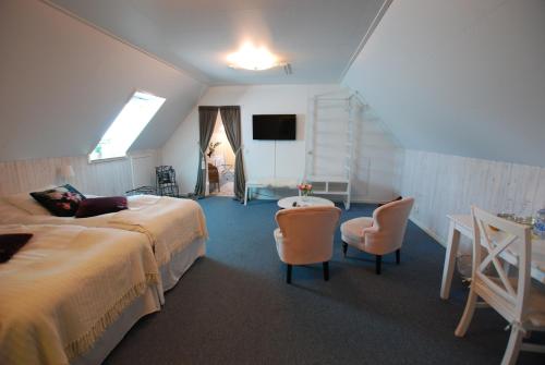 Postel nebo postele na pokoji v ubytování Hotell Turistgården i Simrishamn