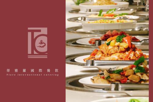 a row of plates of food on a table at Darlon Hotel in Hsinchu City