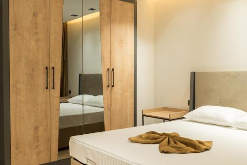 a bedroom with two beds and a mirror at LOFT85 in Antalya
