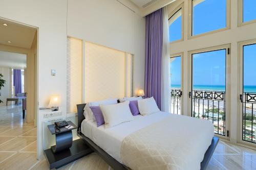 Säng eller sängar i ett rum på Las Arenas Balneario Resort