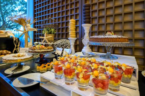a table with many different types of food on it at Las Arenas Balneario Resort in Valencia