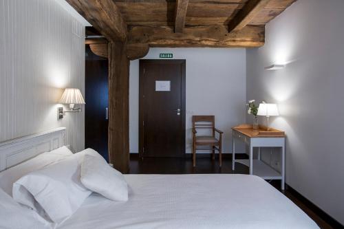 Postel nebo postele na pokoji v ubytování Casa Rural Enea