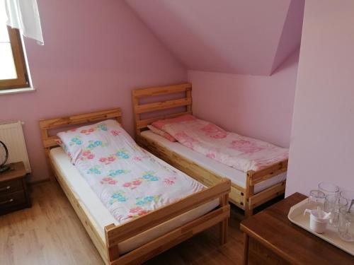 Postel nebo postele na pokoji v ubytování Mazurska Knieja