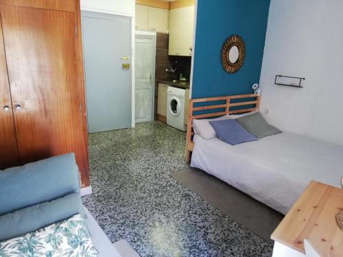 Ένα ή περισσότερα κρεβάτια σε δωμάτιο στο Estudio acogedor