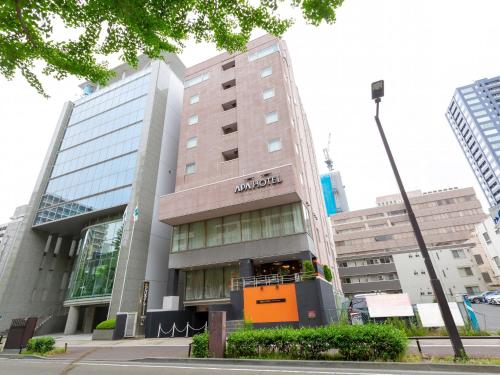 a moxy building in a city with at APA Hotel Sendai Kotodai Koen in Sendai