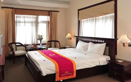 Giường trong phòng chung tại Camela Hotel & Resort