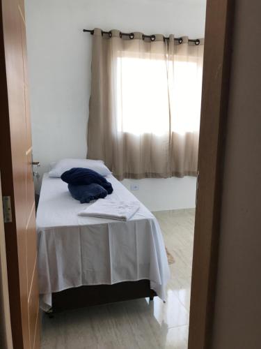 Ένα ή περισσότερα κρεβάτια σε δωμάτιο στο Pousada Anjos da Montanha