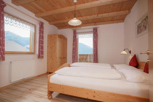 Кровать или кровати в номере Gasleidhof