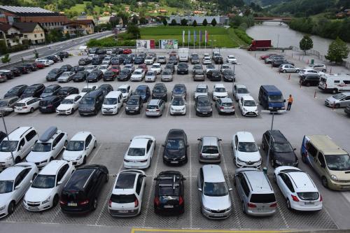 a parking lot filled with lots of parked cars at Hotel Thermana Park Laško**** Superior in Laško