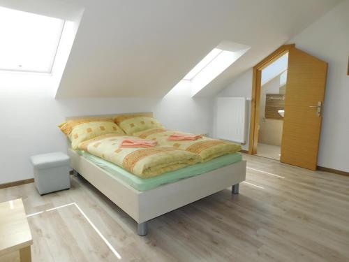 a bedroom with a bed in a attic at Villa Petko in Vysoke Tatry - Dolny Smokovec