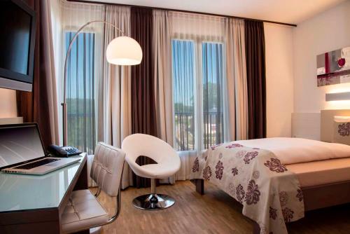 Postel nebo postele na pokoji v ubytování Hotel Simon's Plaza
