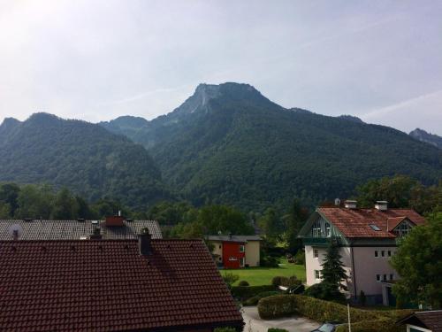 a view of a mountain range with houses and mountains at Alpin Chic in Grödig