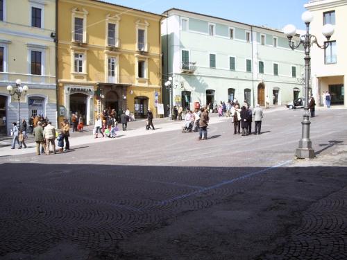 a group of people walking around a city street at Nel Vicolo Luxury B&B in Penne