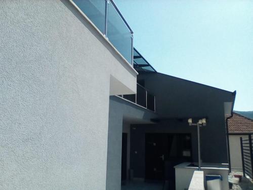 a building with a staircase on the side of it at Rooms Villa Downtown in Mostar