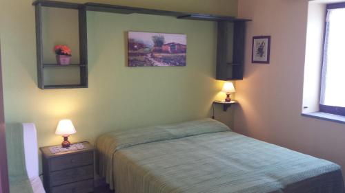 A bed or beds in a room at Salina Acroeoliano monolocale panoramico