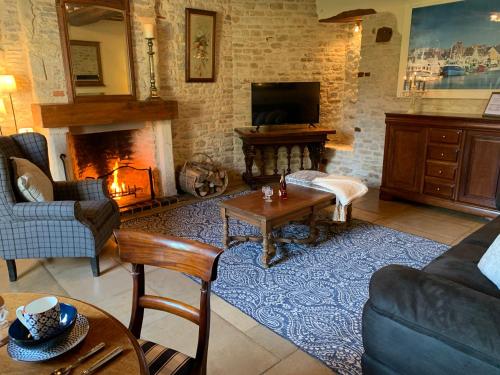 Μια τηλεόραση ή/και κέντρο ψυχαγωγίας στο Holiday home Haras du Ry