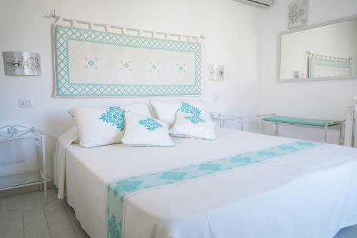 Postel nebo postele na pokoji v ubytování Hotel Regina Simius