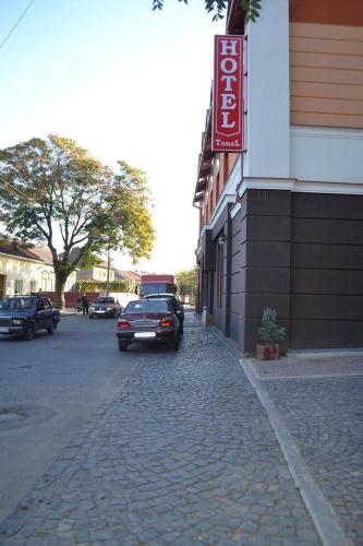 a car parked on a street next to a building at Tonal in Mukacheve