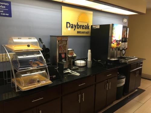 a kitchen with a counter top with a counter top at Days Inn by Wyndham Eufaula AL in Eufaula