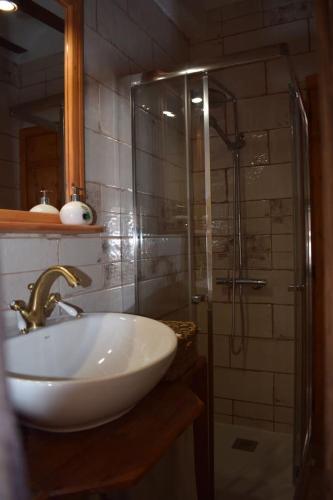 a bathroom with a sink and a shower at Casa Balcón de Albarracín in Albarracín