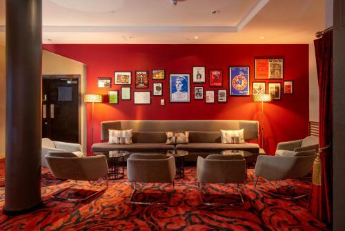 a living room with a couch and chairs at Pullman London St Pancras in London